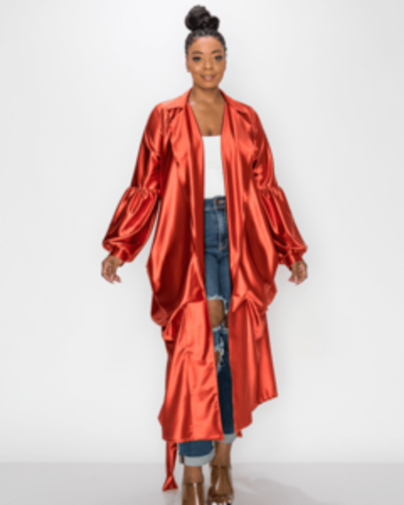 Front of a model wearing a size 1X Lyla Satin Belted Coat in Satin Rust by L I V D. | dia_product_style_image_id:240666